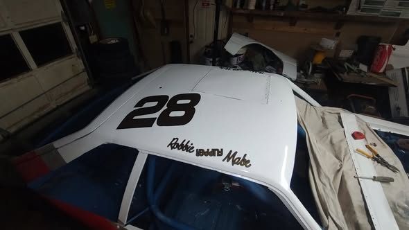 The 28 roof number and Robbie's name above the door, in the shop
